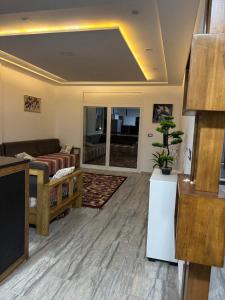 a living room with a couch and a table at Appartement vue mer 200m in Rejiche