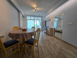 a kitchen and dining room with a table and chairs at GOLD Residence in Sofia