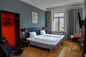 Comfort Hotel Malmö tesisinde bir odada yatak veya yataklar