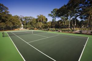 a tennis court with a net on it at Ocean Ridge Resort 1BR Apartment in Edisto Island