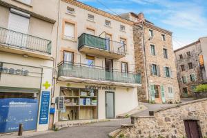 an empty street in front of buildings at Boni in Saint-Julien-Molin-Molette