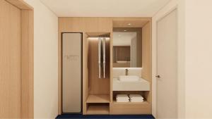 a bathroom with a sink and a mirror at Hotel Inspiroom Jongro in Seoul +52 photos