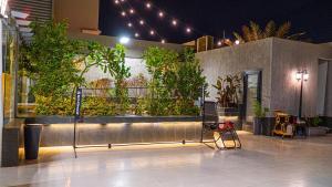 a building with a bunch of plants on a wall at استراحة ليال in Jeddah