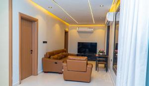 a living room with a couch and a television at استراحة ليال in Jeddah