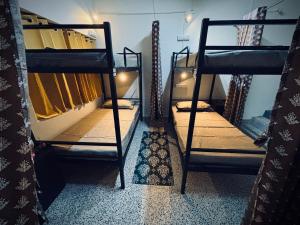 a room with two bunk beds in a room at Deodar Commune in Visakhapatnam