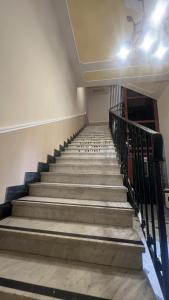 an empty staircase in a building with a stair railing at Agriturismo Relais Kloe in Castel Boglione