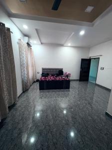 a room with a couch in the middle of a room at NaPrer Homes in Dehradun