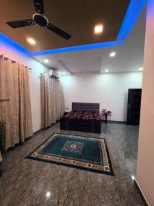 a living room with a couch and a rug at NaPrer Homes in Dehradun