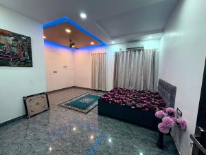 a bedroom with a bed in a room at NaPrer Homes in Dehradun