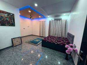 a bedroom with a bed in a room at NaPrer Homes in Dehradun