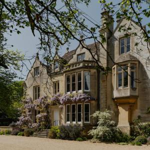 an old house with flowers in front of it at The Green in Wingfield