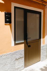 a door on the side of a building at Trepat Harbor's Light in Villajoyosa