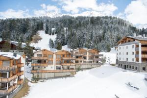 arial view of a resort in the snow at Alpine chic apartment at Rothorn cable car in Lenzerheide