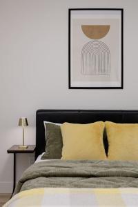 a bedroom with a bed and a picture on the wall at Newly Built Suite-West Coquitlam in Coquitlam +19 photos