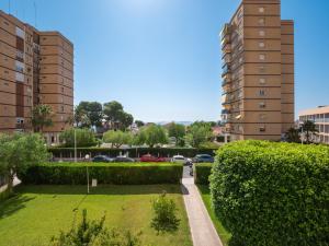 a park in a city with two tall buildings at PERLA de la RIBERA in Santiago de la Ribera