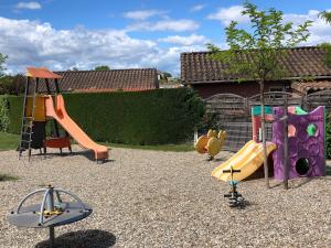 a group of playground equipment in a yard at Mobilhome avec piscine in Ruoms