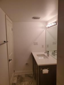 a bathroom with a sink and a mirror at Lake breeze water view in Bowmanville +28 photos