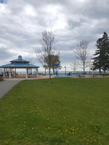 a park with a gazebo and a grass field at Lake breeze water view in Bowmanville
