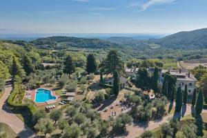 an aerial view of a villa with a pool and trees at Sant'Antonio Country Resort in Montepulciano