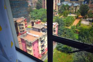 a view of a city from a window at Elegant studio apartment in Kiambu Road Tsavo Apartments in Kiambu