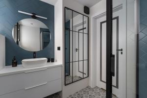 a bathroom with a white sink and a mirror at Cetyna Retreat - Dom w Beskidzie Sądeckim, 8 osób, szlaki, cisza, EV in Rytro +32 photos