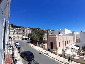 a view of a city street with cars parked on the road at Via Piave 14 in Santa Cesarea Terme
