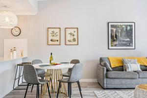 a living room with a table and a couch at Family-friendly Seaside Gem in Urangan