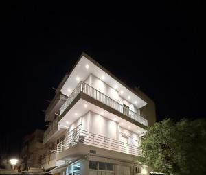 a large building with lights on it at night at Topfix Luxury Home 1 in Kos +9 photos