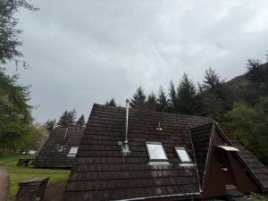 a roof of a house with windows on it at Loch Oich Lodge in Invergarry
