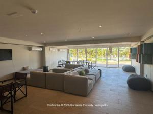 a large living room with a couch and a table at studio to Maho in Cupecoy