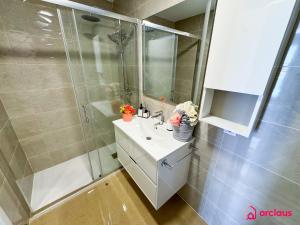 a bathroom with a sink and a shower at Sun & Sea in Cabanes