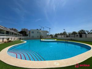 a large swimming pool in the middle of a building at Sun & Sea in Cabanes +42 photos