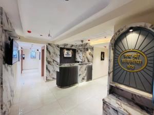 a room with a sign that reads yetfifth institution tie at Hotel Pacific Empire in Ahmedabad