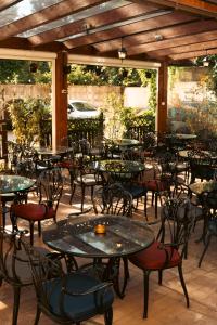 an outdoor patio with tables and chairs at Turn Hostel in Ljubljana