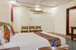 a bedroom with a large white bed in a room at FabHotel Jaipur Classic - Vaishali Nagar in Jāmb