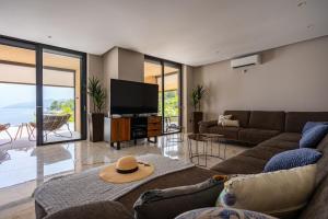 a living room with a couch and a flat screen tv at Kuća za odmor ANTON in Blato