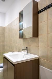 a bathroom with a sink and a mirror at Topfix Luxury Home 2 in Kos