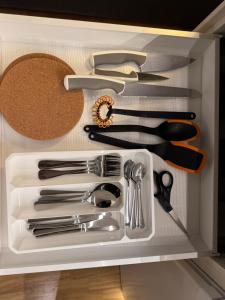 a drawer full of kitchen utensils in a cabinet at Smart mini apartment with kitchen in Åmot