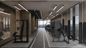 a gym with treadmills and exercise equipment in a building at Radisson Blu Residences, Istanbul Kartal in Istanbul