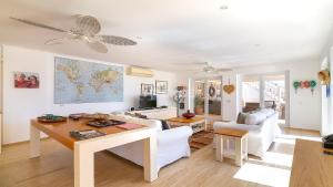 a living room with a table and a couch at TEKCE Villa Dolly N24 in Kalkan