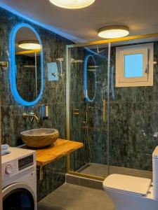a bathroom with a shower and a sink at Giovanni Apartments in Syvota +56 photos
