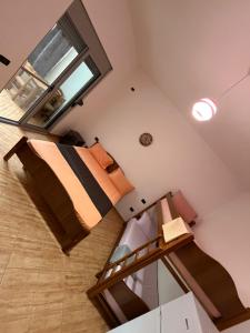 a room with two bunk beds and a window at Vila Emanuele in Shëngjin