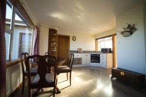 a kitchen with a table and chairs in a room at Annie's in Methven