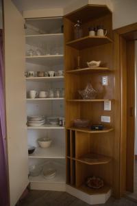 a cupboard filled with lots of plates and bowls at Annie's in Methven