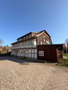 a building on the side of a street at BohnApartments Vogelmühle Ilsenburg in Ilsenburg +24 photos