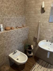 a bathroom with a toilet and a sink at Chalúpka Barborka in Lúčky +32 photos