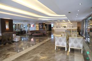 a lobby of a hotel with chairs and tables at Boris Hotel Istanbul Beylikduzu in Beylikduzu