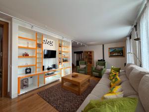 a living room with a couch and a table at Cortea I y II in Añézcar