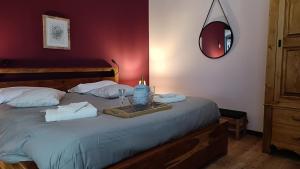 a bedroom with a bed with a tray with candles on it at La Cerasa in Contigliano +67 photos