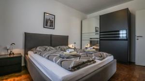 a large bed in a bedroom with a large mirror at Sonnengarten floor 1 in Marčana +14 photos